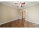 Office space featuring hardwood floors, a ceiling fan, and an open doorway to the bathroom at 3043 Santee Ct, Fort Mill, SC 29707