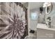 Well-lit bathroom featuring a stylish shower curtain, vanity, and modern decor at 308 Gillsbrook Rd, Lancaster, SC 29720