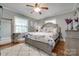 Elegant bedroom with a decorative bed frame, wood floors, and soft, neutral colors at 308 Gillsbrook Rd, Lancaster, SC 29720