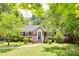 Charming brick home with lush landscaping and inviting front porch, perfect for enjoying the outdoors at 308 Gillsbrook Rd, Lancaster, SC 29720