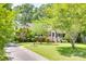 Charming single-story brick home with well-manicured lawn and mature shade trees at 308 Gillsbrook Rd, Lancaster, SC 29720