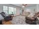 Bright living room offers hardwood floors, large windows, and comfortable seating at 308 Gillsbrook Rd, Lancaster, SC 29720