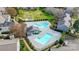 Aerial view of community pools and surrounding community with lots of landscaping at 3109 Heathstead Pl, Charlotte, NC 28210