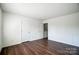 Bedroom with wood floors and a double door closet at 3109 Heathstead Pl, Charlotte, NC 28210