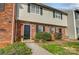 Charming brick townhome with well-maintained lawn and inviting black front door at 3109 Heathstead Pl, Charlotte, NC 28210