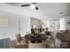 Cozy living room with dining area, fireplace, and sliding glass doors to outdoor space at 3109 Heathstead Pl, Charlotte, NC 28210