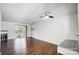 Spacious living room featuring hardwood floors, a fireplace, and sliding glass doors at 3109 Heathstead Pl, Charlotte, NC 28210
