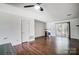 Well-lit living room with hardwood floors, a cozy fireplace, and an open layout at 3109 Heathstead Pl, Charlotte, NC 28210