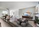 Open-concept living area features a dining area and a fireplace with hardwood flooring at 3109 Heathstead Pl, Charlotte, NC 28210