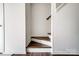 View of the home's staircase with wood detailing at 3109 Heathstead Pl, Charlotte, NC 28210