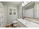 Bathroom featuring modern fixtures, a large mirror, and a shower with a patterned curtain at 3901 Kitley Pl, Charlotte, NC 28210