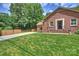 Charming front yard view of brick home with lush green lawn and driveway at 3901 Kitley Pl, Charlotte, NC 28210