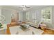 Spacious living room featuring hardwood floors, stylish furniture, and bright natural light at 3901 Kitley Pl, Charlotte, NC 28210