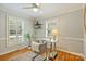Bright home office with white shutters, hardwood floors, and comfortable desk space at 3901 Kitley Pl, Charlotte, NC 28210