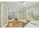 Well-lit office space with French doors, hardwood floors, and a cozy workspace at 3901 Kitley Pl, Charlotte, NC 28210