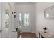Bright entryway featuring a decorative glass door and coat rack at 4040 Deep River Way, Waxhaw, NC 28173