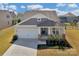 Aerial view of a lovely single-Gathering home with a pristine lawn and perfectly manicured landscaping at 4040 Deep River Way, Waxhaw, NC 28173