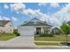 Charming one-story home with well-manicured lawn, attached garage and inviting front porch at 4040 Deep River Way, Waxhaw, NC 28173
