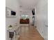 Hallway featuring hardwood floors, leading to an open-concept living area and bedrooms at 4040 Deep River Way, Waxhaw, NC 28173