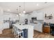 Beautiful kitchen with white cabinets, stainless steel appliances, and a large island at 4040 Deep River Way, Waxhaw, NC 28173