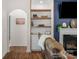 Comfortable living room featuring custom built-in shelving and a modern fireplace at 4040 Deep River Way, Waxhaw, NC 28173