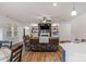 Spacious living room featuring a fireplace, built-in shelving, and comfortable seating at 4040 Deep River Way, Waxhaw, NC 28173