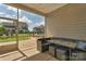 Enclosed patio with a view of a well-maintained backyard and neighboring houses at 4040 Deep River Way, Waxhaw, NC 28173