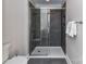 Elegant bathroom featuring a tiled shower with glass door, providing a luxurious and modern experience at 4625 Piedmont Row Dr # 410, Charlotte, NC 28210