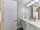 Well-lit bathroom featuring a modern vanity with marble countertop and a stylish faucet at 4625 Piedmont Row Dr # 410, Charlotte, NC 28210