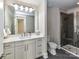 Stylish bathroom featuring double sinks, a spacious mirror, and a modern shower with elegant design at 4625 Piedmont Row Dr # 410, Charlotte, NC 28210