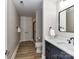 Modern bathroom with a sleek vanity, framed mirror, toilet, and tiled shower for a luxurious experience at 4625 Piedmont Row Dr # 410, Charlotte, NC 28210