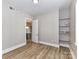 Bedroom with wood floors, shelves, and a light gray paint at 4625 Piedmont Row Dr # 410, Charlotte, NC 28210