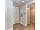 Welcoming entryway with natural light, white walls, and light wood floor at 4625 Piedmont Row Dr # 410, Charlotte, NC 28210