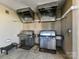 Modern grilling area featuring stainless steel grills and convenient ventilation at 4625 Piedmont Row Dr # 410, Charlotte, NC 28210