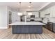 A stunning kitchen with stainless steel appliances and a large white counter top island at 4625 Piedmont Row Dr # 410, Charlotte, NC 28210