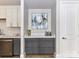 Kitchen area with gray cabinets and stainless steel dishwasher at 4625 Piedmont Row Dr # 410, Charlotte, NC 28210