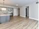 Bright living room with gray and white paint and a kitchen view at 4625 Piedmont Row Dr # 410, Charlotte, NC 28210