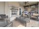 Inviting outdoor patio with a fireplace, ceiling fan, and built-in grill, perfect for outdoor cooking at 4625 Piedmont Row Dr # 410, Charlotte, NC 28210