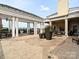 Expansive outdoor terrace featuring multiple seating areas and lush potted plants at 4625 Piedmont Row Dr # 410, Charlotte, NC 28210