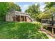 Large backyard with lush green grass and a house with a deck and stairs at 4700 Hickory Grove Rd, Mount Holly, NC 28120