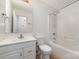 Bathroom with a tub/shower combo, single sink vanity, light walls, and tiled floors at 4700 Hickory Grove Rd, Mount Holly, NC 28120