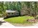 Two story home with lush landscaping and mature trees at 4700 Hickory Grove Rd, Mount Holly, NC 28120