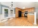 Kitchen with hardwood floors, wood cabinets, and stainless-steel appliances at 4700 Hickory Grove Rd, Mount Holly, NC 28120