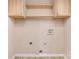 Functional laundry area with cabinets and hookups for machines at 4700 Hickory Grove Rd, Mount Holly, NC 28120