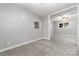 Inviting living room with neutral walls and carpet; natural light at 4700 Hickory Grove Rd, Mount Holly, NC 28120