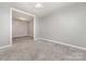 Inviting living room with neutral walls and plush carpet at 4700 Hickory Grove Rd, Mount Holly, NC 28120