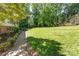 Green grass lawn and brick edged flower beds at 4700 Hickory Grove Rd, Mount Holly, NC 28120