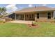 Spacious backyard features covered patio, outdoor grill, and landscaped lawn at 5059 Valita Rd, York, SC 29745