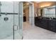 Elegant bathroom with marble floors, a glass-enclosed shower, and black vanity at 5059 Valita Rd, York, SC 29745