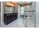 Modern bathroom featuring sleek vanity, a glass-enclosed shower with marble tile, and a bright, airy design at 5059 Valita Rd, York, SC 29745